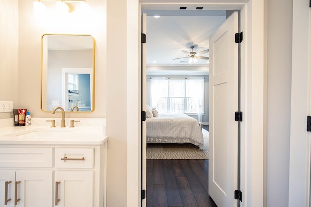 bathroom featuring vanity, hardwood / wood-style flooring, and ceiling fan