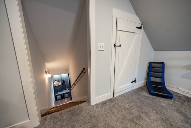 bonus room featuring carpet flooring and vaulted ceiling