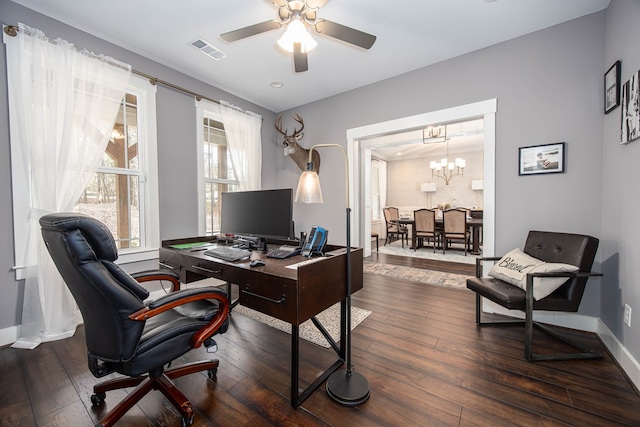 office with dark wood-type flooring and ceiling fan with notable chandelier