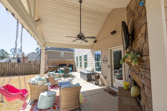 view of patio / terrace with ceiling fan, outdoor dining space, an outdoor hangout area, and fence