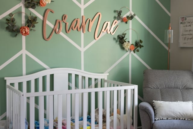 bedroom with a nursery area