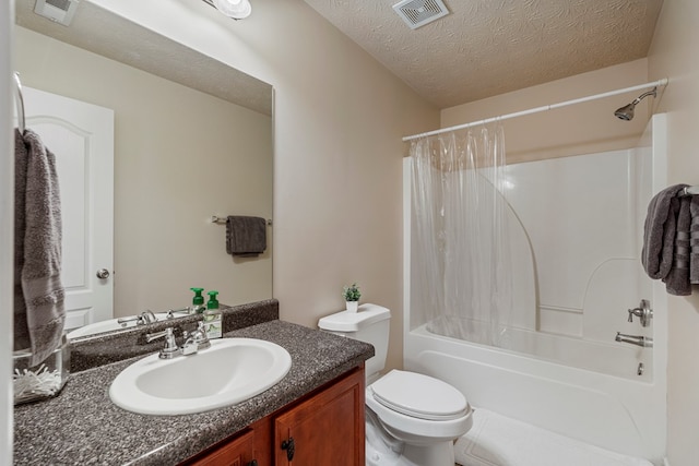 full bathroom with visible vents, toilet, a textured ceiling, shower / tub combo, and vanity