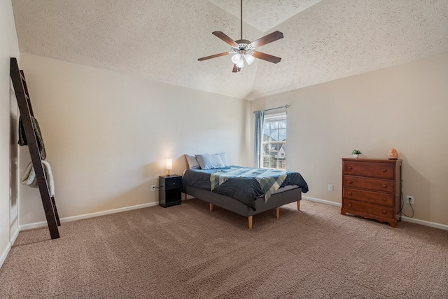 bedroom featuring baseboards, light colored carpet, vaulted ceiling, a textured ceiling, and a ceiling fan