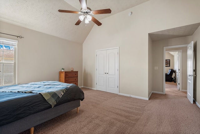 bedroom with baseboards, light carpet, a textured ceiling, and ceiling fan