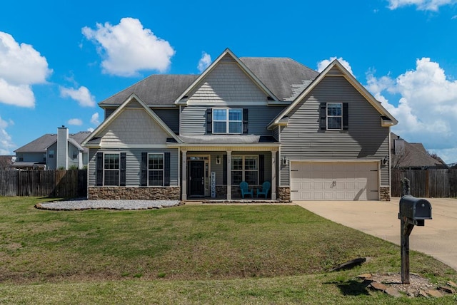 craftsman-style home with stone siding, concrete driveway, an attached garage, and fence