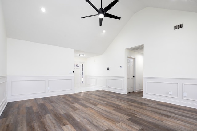 unfurnished living room featuring lofted ceiling, dark wood-type flooring, and ceiling fan