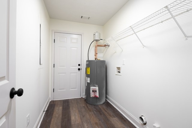 utility room featuring water heater