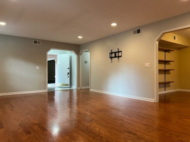 empty room with dark hardwood / wood-style floors