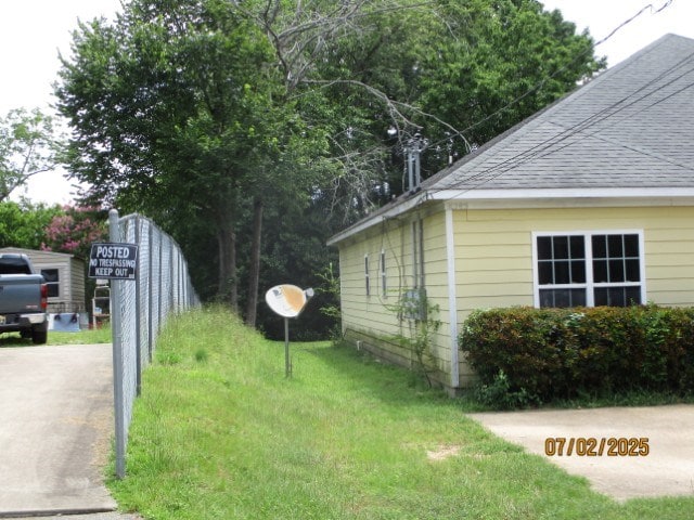 1902 6th Ct, Phenix City, AL 36867 - view of side of property with a shingled roof