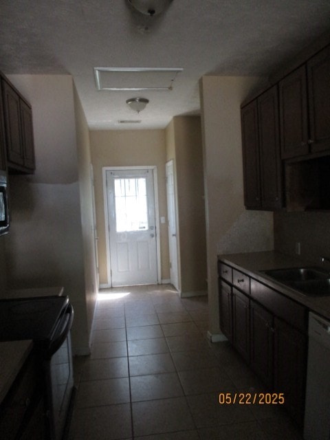 1902 6th Ct, Phenix City, AL 36867 - kitchen featuring black electric range, dishwasher, and light tile patterned floors