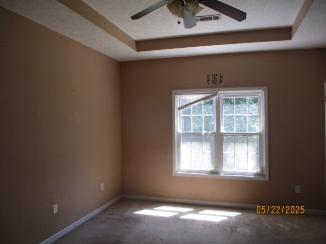 1902 6th Ct, Phenix City, AL 36867 - carpeted spare room featuring a ceiling fan and a raised ceiling