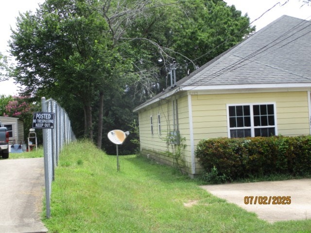 1902 6th Ct, Phenix City, AL 36867 - view of side of home with a shingled roof