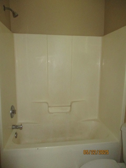 1902 6th Ct, Phenix City, AL 36867 - bathroom featuring toilet and bathtub / shower combination