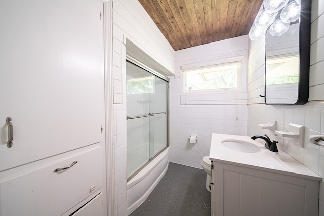 813 Crockett Dr, Columbus, GA 31904 - full bathroom with vanity, healthy amount of natural light, wooden ceiling, combined bath / shower with glass door, and tile walls