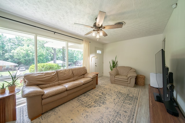 813 Crockett Dr, Columbus, GA 31904 - living area featuring a textured ceiling, a ceiling fan, and wood finished floors