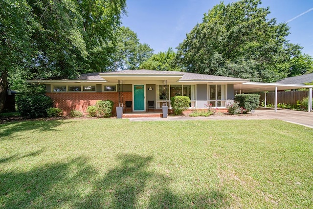 813 Crockett Dr, Columbus, GA 31904 - view of front of house featuring concrete driveway, a carport, brick siding, and covered porch