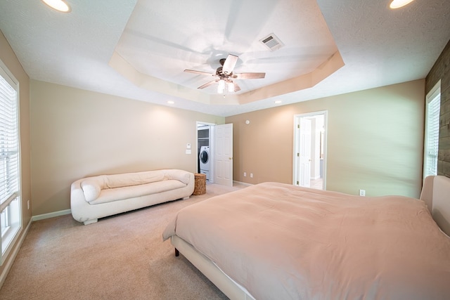 813 Crockett Dr, Columbus, GA 31904 - carpeted bedroom with multiple windows, washer / clothes dryer, a tray ceiling, and recessed lighting