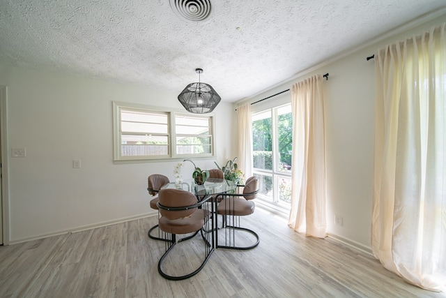 813 Crockett Dr, Columbus, GA 31904 - dining space with wood finished floors and a textured ceiling
