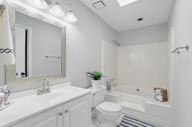 bathroom featuring toilet, visible vents, washtub / shower combination, and vanity