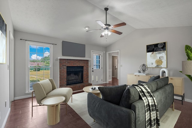 living room with ceiling fan, wood finished floors, a healthy amount of sunlight, and baseboards
