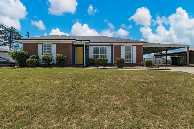 ranch-style home featuring driveway, a front yard, an attached carport, and brick siding