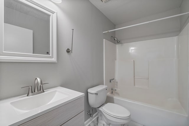 bathroom with toilet, shower / washtub combination, and vanity