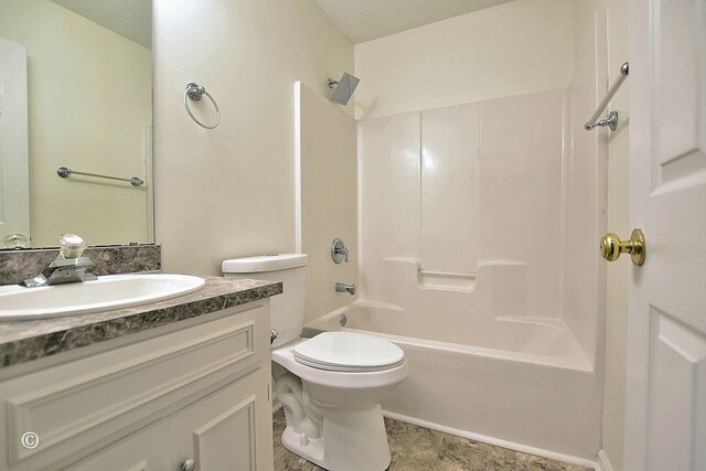 84 Summerbrook Loop, Smiths Station, AL 36870 - bathroom featuring a textured ceiling, tile patterned flooring, shower / washtub combination, vanity, and toilet
