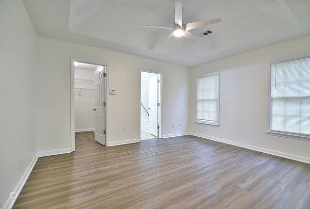 84 Summerbrook Loop, Smiths Station, AL 36870 - interior space with visible vents, a ceiling fan, baseboards, and wood finished floors