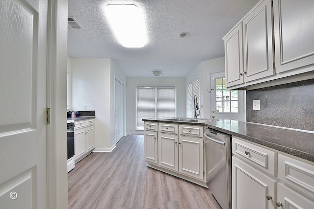 84 Summerbrook Loop, Smiths Station, AL 36870 - kitchen with a textured ceiling, range, dishwasher, a sink, and light wood finished floors