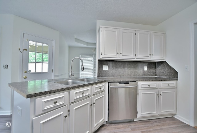 84 Summerbrook Loop, Smiths Station, AL 36870 - kitchen featuring a sink, a wealth of natural light, a peninsula, and dishwasher