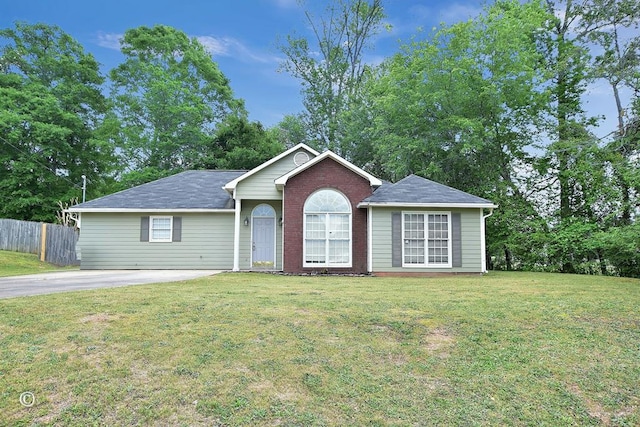 84 Summerbrook Loop, Smiths Station, AL 36870 - ranch-style house with fence, brick siding, and a front yard
