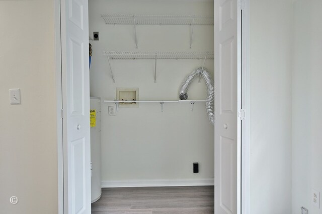 84 Summerbrook Loop, Smiths Station, AL 36870 - washroom featuring hookup for an electric dryer, laundry area, wood finished floors, baseboards, and hookup for a washing machine