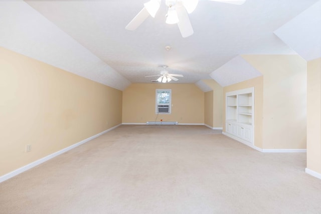 5110 Midland Trce, Columbus, GA 31820 - bonus room featuring light colored carpet, a ceiling fan, built in shelves, vaulted ceiling, and a baseboard radiator