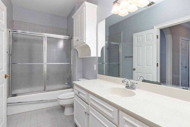5110 Midland Trce, Columbus, GA 31820 - full bath featuring vanity, tile patterned flooring, enclosed tub / shower combo, and a chandelier