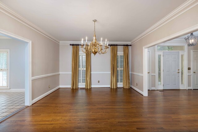 5110 Midland Trce, Columbus, GA 31820 - unfurnished dining area featuring a chandelier, crown molding, and wood finished floors