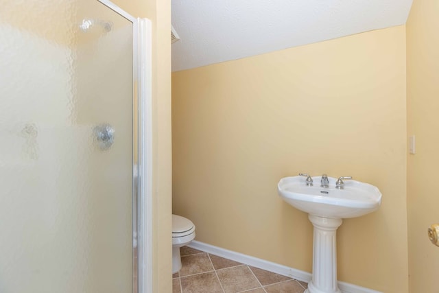 5110 Midland Trce, Columbus, GA 31820 - bathroom with a shower stall, tile patterned floors, and a textured ceiling