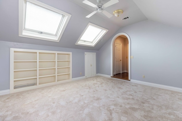 5110 Midland Trce, Columbus, GA 31820 - additional living space with lofted ceiling, carpet, a ceiling fan, built in features, and a skylight