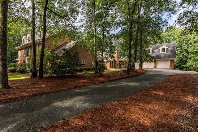 5110 Midland Trce, Columbus, GA 31820 - view of front facade featuring asphalt driveway, a garage, and brick siding
