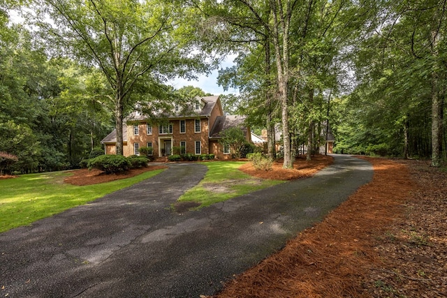 5110 Midland Trce, Columbus, GA 31820 - colonial house with asphalt driveway, brick siding, and a front lawn