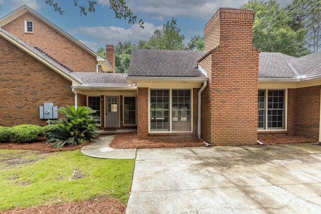5110 Midland Trce, Columbus, GA 31820 - view of front of home featuring a garage, driveway, brick siding, and roof with shingles