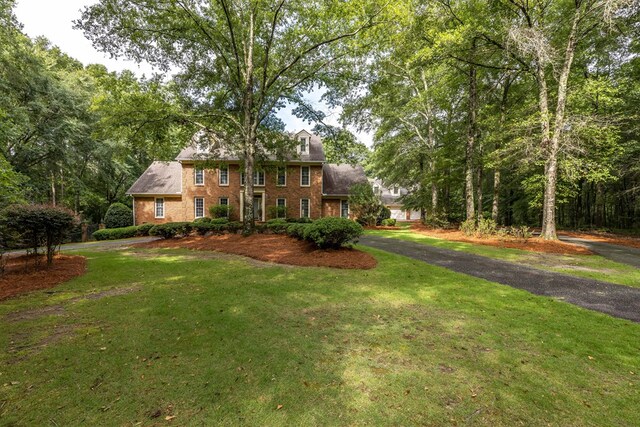 5110 Midland Trce, Columbus, GA 31820 - view of front facade featuring brick siding, a front lawn, and driveway