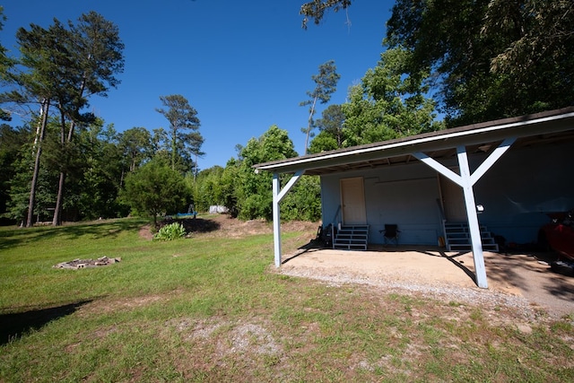 50 Old Opelika Rd, Phenix City, AL 36870 - view of green lawn with entry steps and a carport