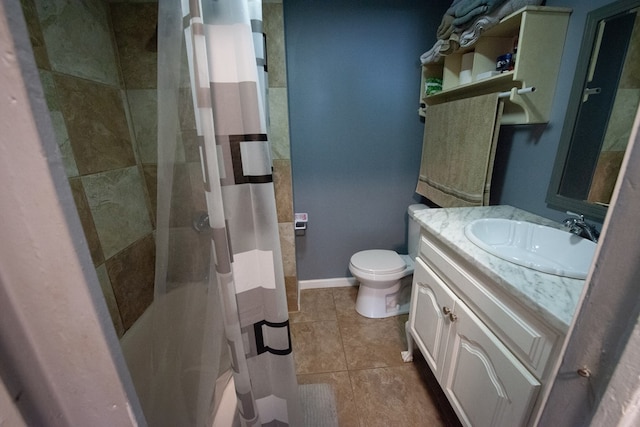 50 Old Opelika Rd, Phenix City, AL 36870 - bathroom with toilet, vanity, tile patterned floors, and baseboards