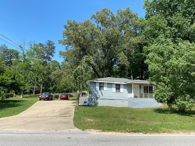 50 Old Opelika Rd, Phenix City, AL 36870 - view of front of home with concrete driveway, a front lawn, and a porch