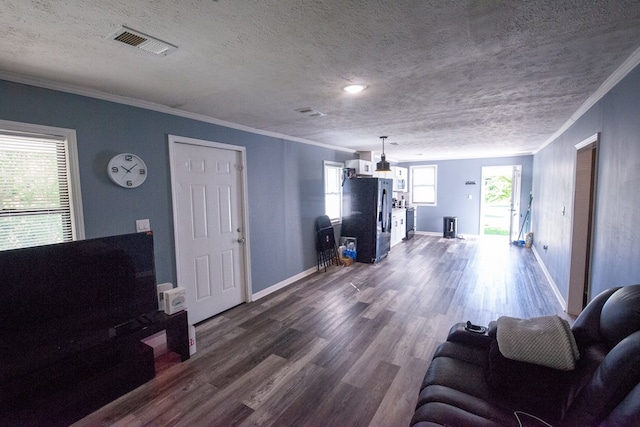 50 Old Opelika Rd, Phenix City, AL 36870 - living room with dark wood-type flooring, crown molding, baseboards, and a textured ceiling