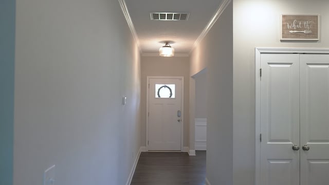 8840 Sullivans Dr, Midland, GA 31820 - doorway to outside featuring crown molding, baseboards, and dark wood-type flooring