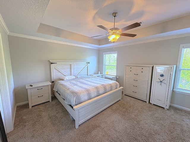 8840 Sullivans Dr, Midland, GA 31820 - bedroom featuring a raised ceiling, light carpet, multiple windows, crown molding, and baseboards
