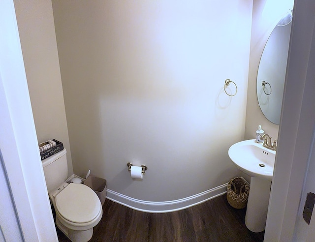 8840 Sullivans Dr, Midland, GA 31820 - bathroom featuring wood finished floors, baseboards, and toilet