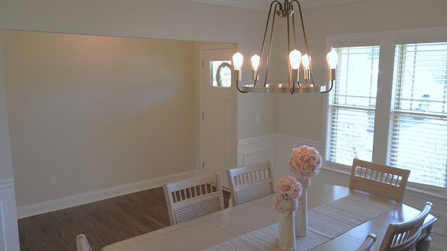 8840 Sullivans Dr, Midland, GA 31820 - dining room with healthy amount of natural light, a chandelier, and wood finished floors