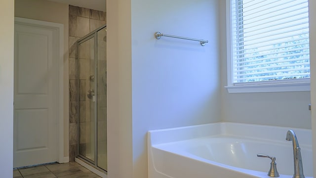 8840 Sullivans Dr, Midland, GA 31820 - bathroom with a garden tub and a shower stall